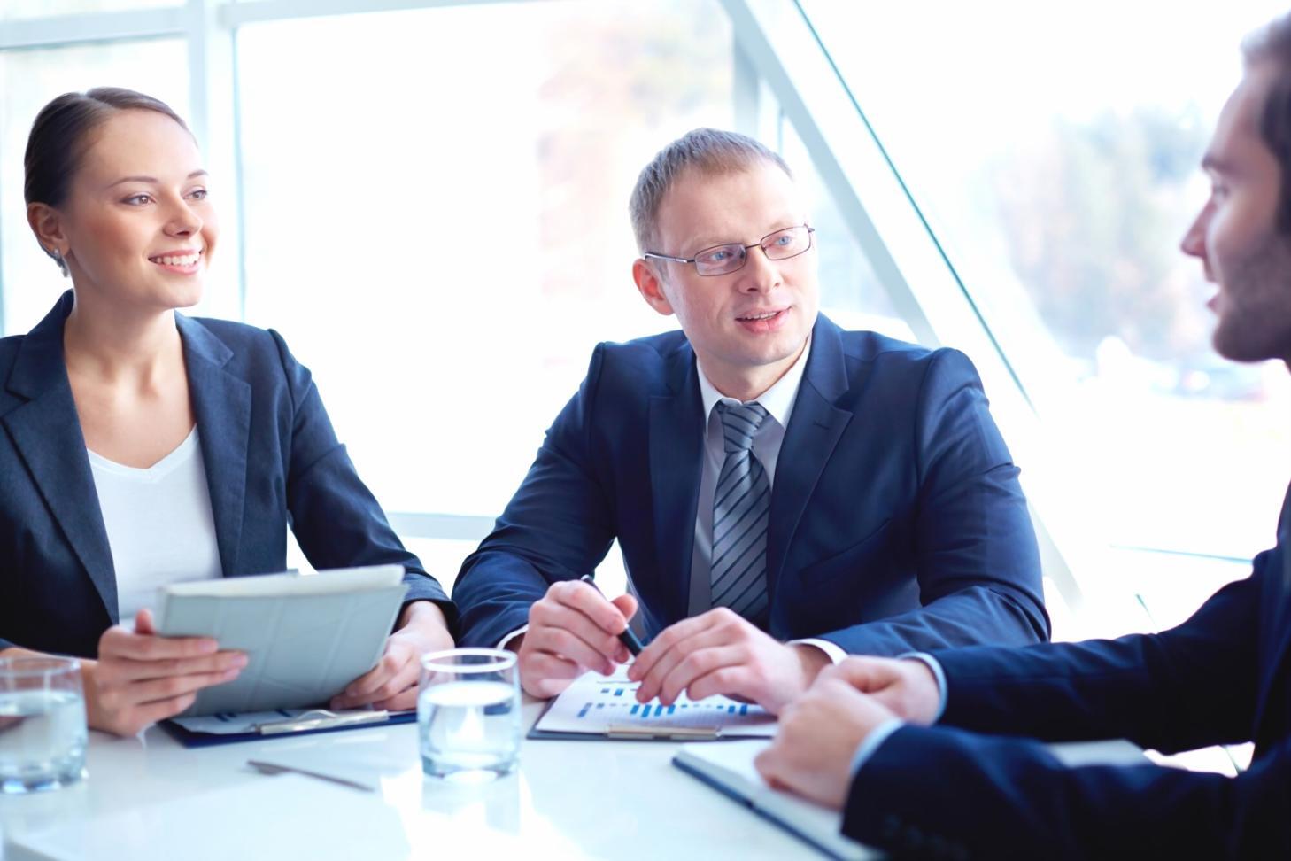 Business team collaborating on financial strategy after automation implementation